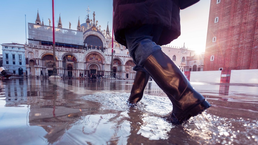 Woman wades through water