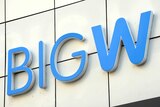 A large blue BIG W logo erected on the wall of a shopping mall in Australia.