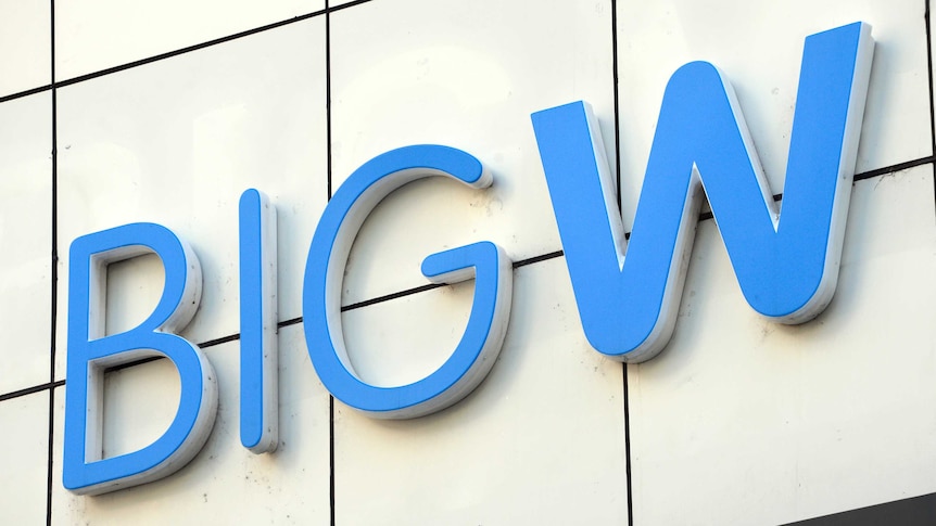 A large blue BIG W logo erected on the wall of a shopping mall in Australia.