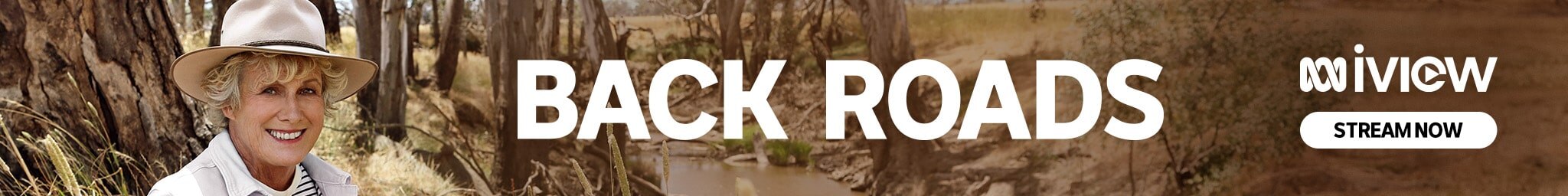 Female journalist smilES in an Akubra hat with eucalypt-lined creek in background. Text reads "BACK ROADS iview STREAM NOW"