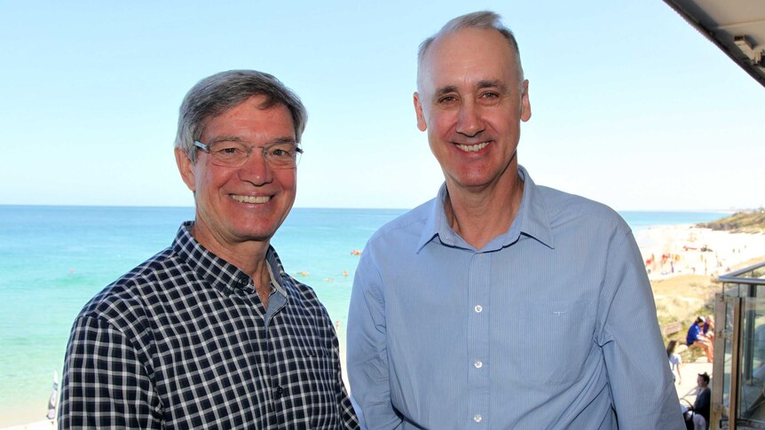 Liberal leader Mike Nahan stands on a balcony with the beach in the background with just-elected Cottesloe MP David Honey.