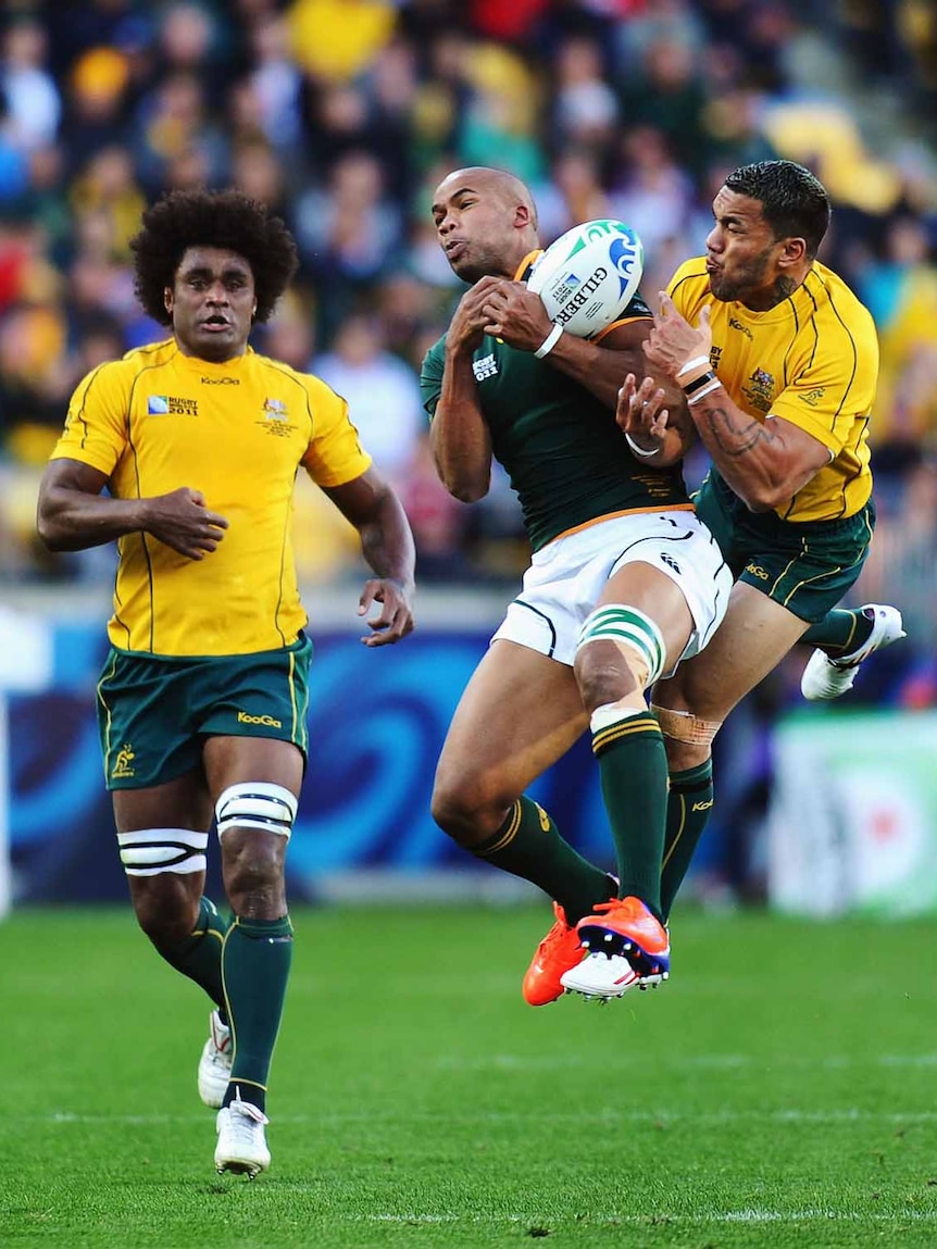 Aerial contest ... South Africa's JP Pietersen battles Digby Ioane for possession.