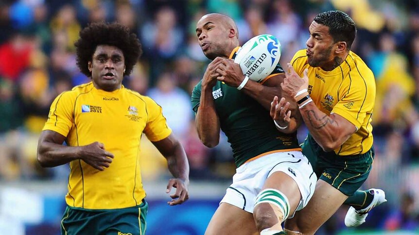 Aerial contest ... South Africa's JP Pietersen battles Digby Ioane for possession.