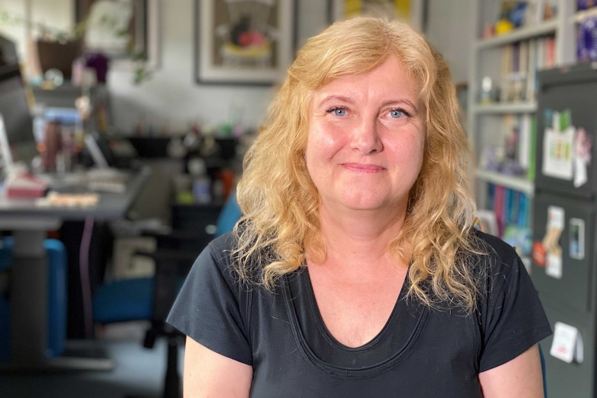 Nancy Pachana in her office adorned with cat imagery.