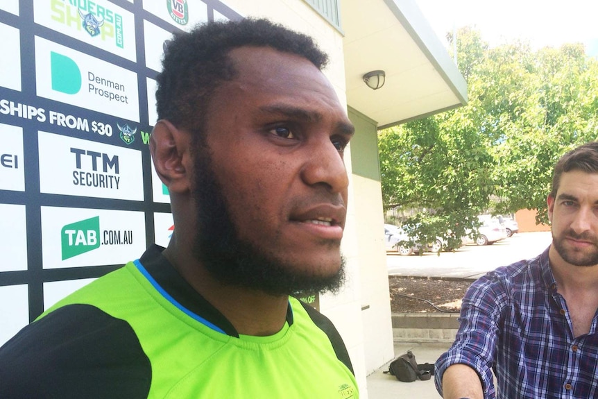 Kato Ottio speaks to reporters.