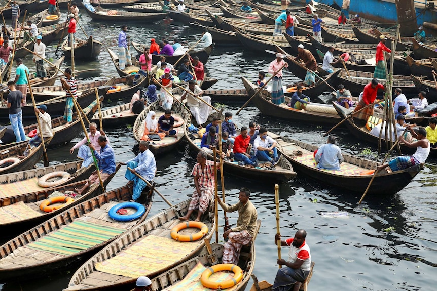 A bunch of boats in a port in Dhaka