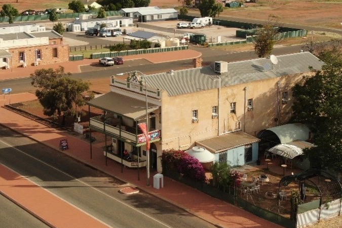 A drone shot of an outback pub.