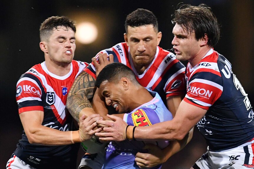Roosters players tackle Ronaldo Mulitalo