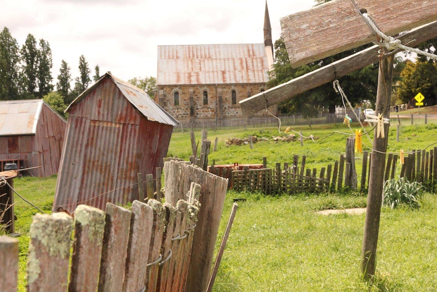 A clothes line and several historic buildings at Hill End