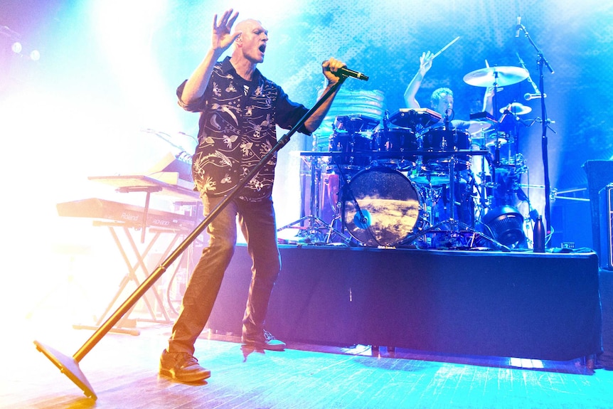 Peter Garrett singing on stage in New York