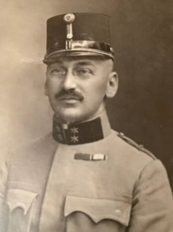 Dr Siegmund Defris appears in a black and white image wearing a German military uniform from WWI.