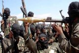 Boko Haram, including fighter holding missile launcher, on a raid in Nigeria