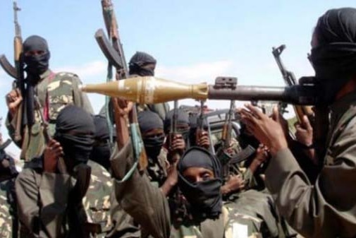 On a raid in Nigeria, members of Boko Haram hold guns and missile launcher