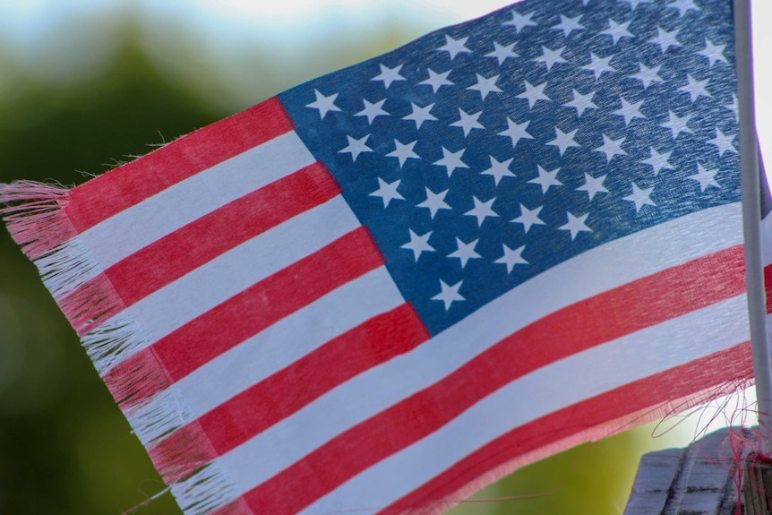 A close up shot of a small American flag