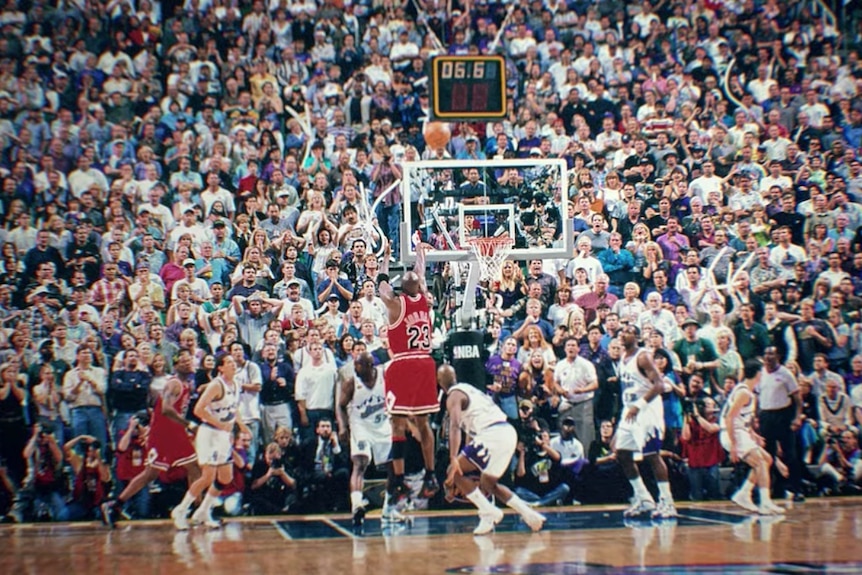 Michael Jordan shoots a game-winning shot in game six of the 1998 NBA Finals against the Utah Jazz.