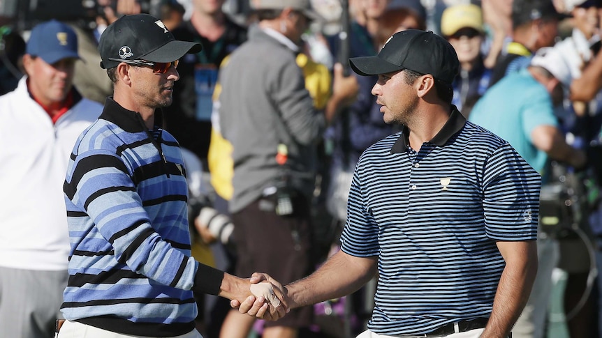 Jason Day and Adam Scott shake hands at the Presidents Cup
