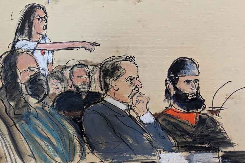 In this courtroom sketch, one of the victims stands and points as she shouts at Saipov, who is seated in front row.