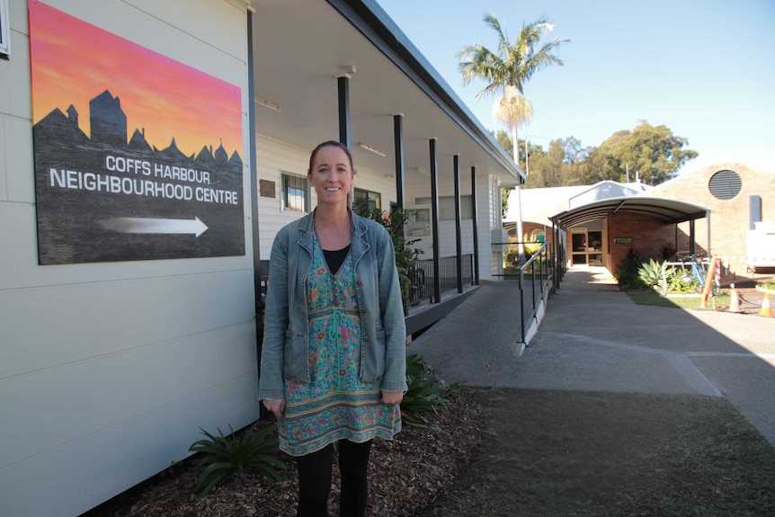 A woman standing outside a Neighbourhood Centre