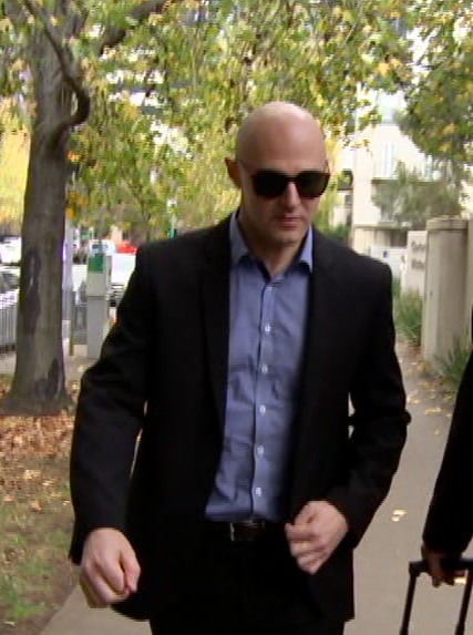 Dragi Stojanovski and Robert Galbally walk outside.