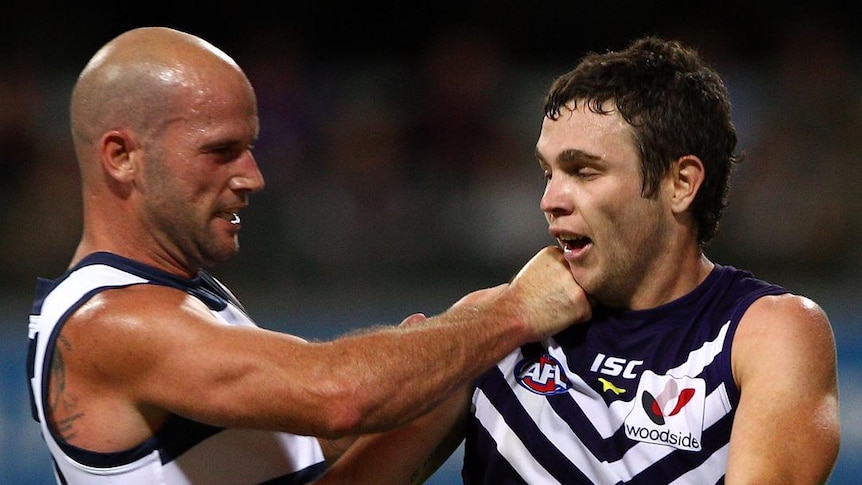 Milestone man ... Paul Chapman gets physical in his 200th game with the Dockers' Hayden Ballantyne.