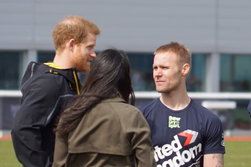 Harry and Meghan took time to speak to the athletes at the track.