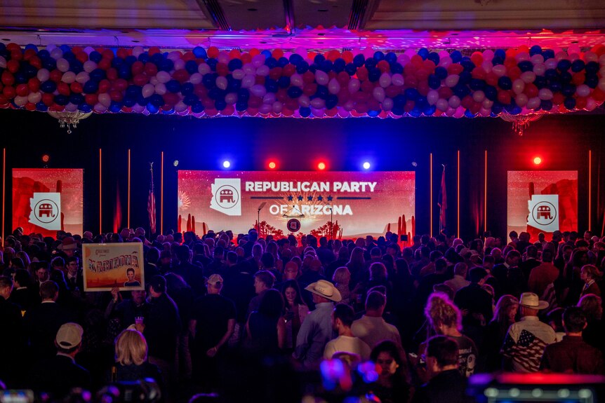 A shot of a ballroom at night with "Republican Party of Arizona" written on the wall