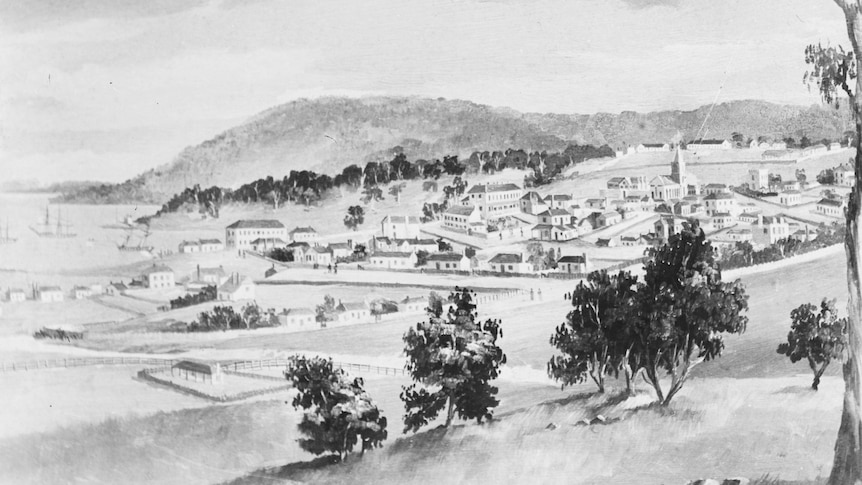Black and white copy of a painting of Hobart Town in 1822, buildings are dotted across a hill and theres a ship on the harbour.
