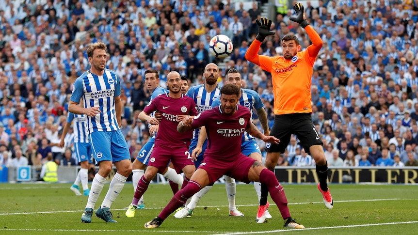 Manchester City's Kyle Walker in action with Brighton's Mathew Ryan in the Premier League.