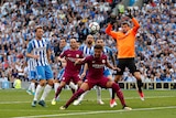 Manchester City's Kyle Walker in action with Brighton's Mathew Ryan in the Premier League.