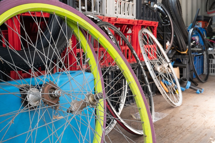 Shipping container filled with spare bike parts.