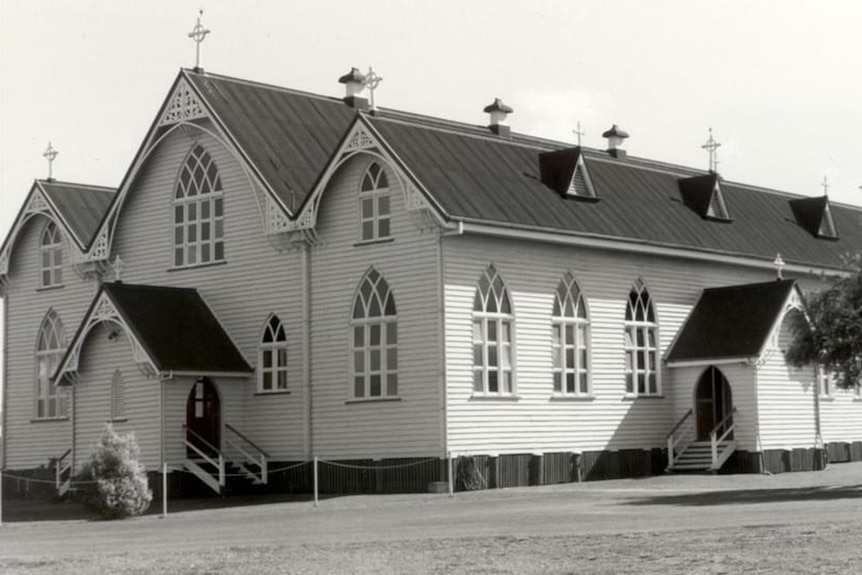 An old black and white photograph of a wooden church built west of Brisbane in 1910