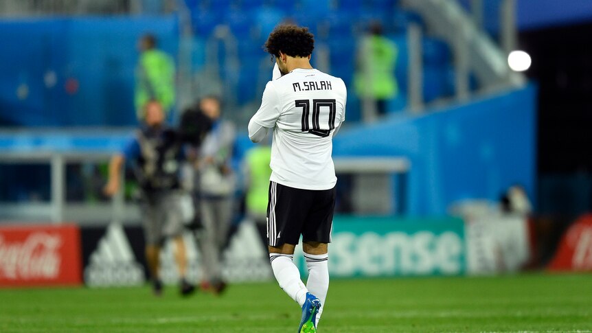 Mohamed Salah reacts after Egypt's loss to Russia