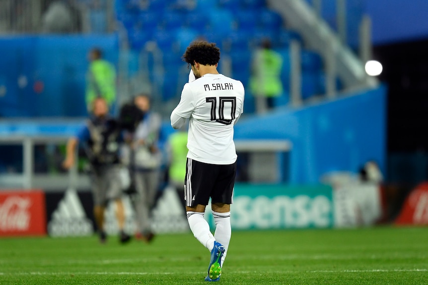 Mohamed Salah reacts after Egypt's loss to Russia