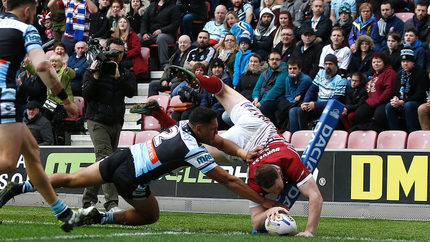 Joe Burgess scores the first try for Wigan