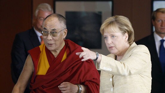 Angela Merkel (R) defied Chinese warnings to became the first German Chancellor to meet the Dalai Lama.