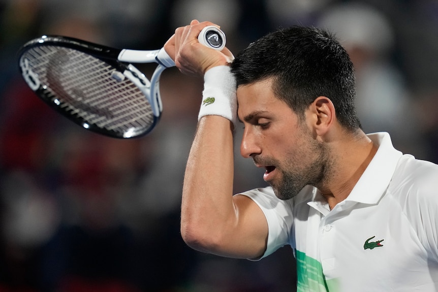 Serbia's Novak Djokovic looks disappointed after he lost a point against Czech Republic's Jiri Vesely at Dubai Championships