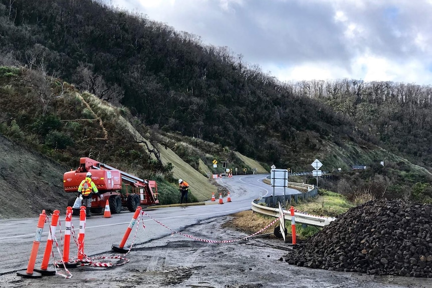Workman recover parts of the Great Ocean Road between Wye River and Kennett River after landslips.