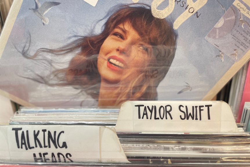 A stack of records with a picture of Taylor Swift and her name