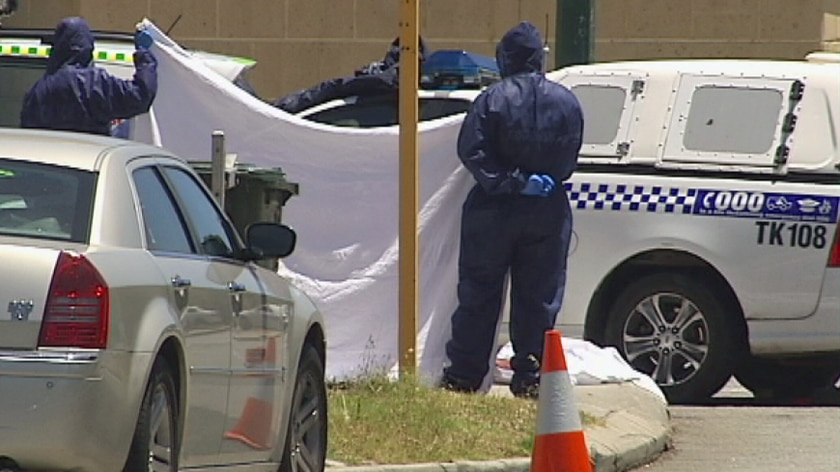 Forensic officers at the scene of a fatal police shooting