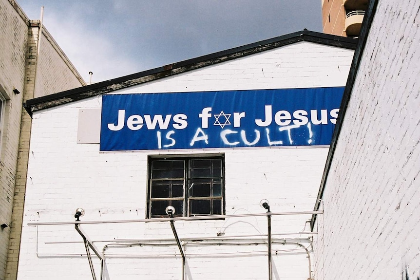 Graffiti on Jews for Jesus sign.