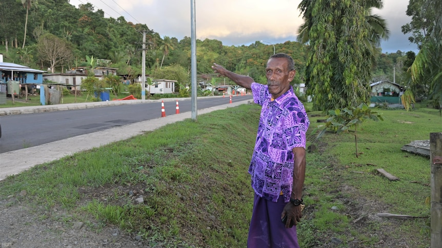 Nalalawa Village Headman Epeli Karitakia points at the village evacuation centre or area