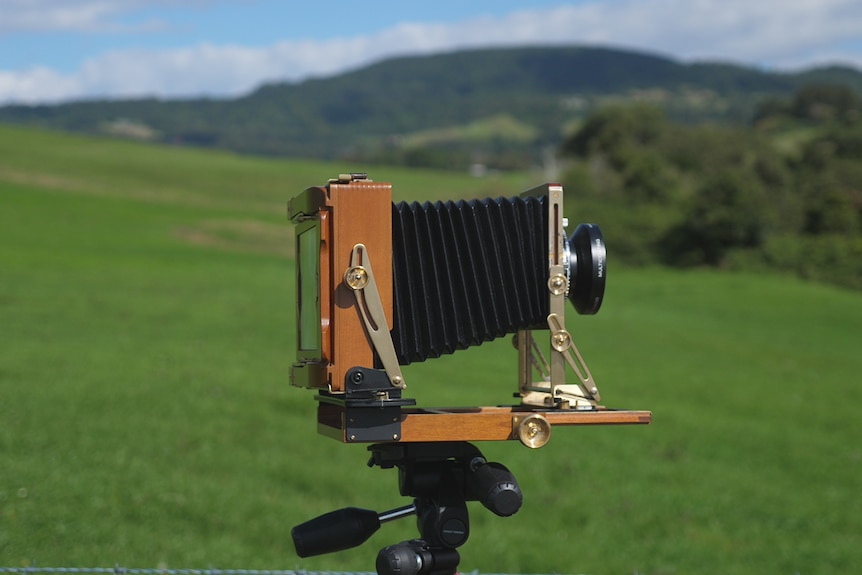 An old film camera in the field. 