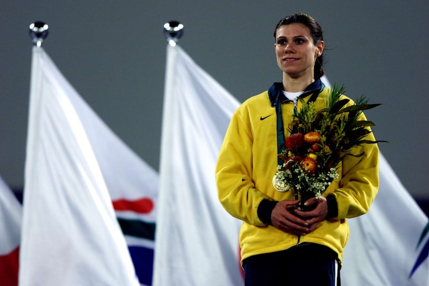 A woman on a podium at the Sydney 2000 Paralympics.