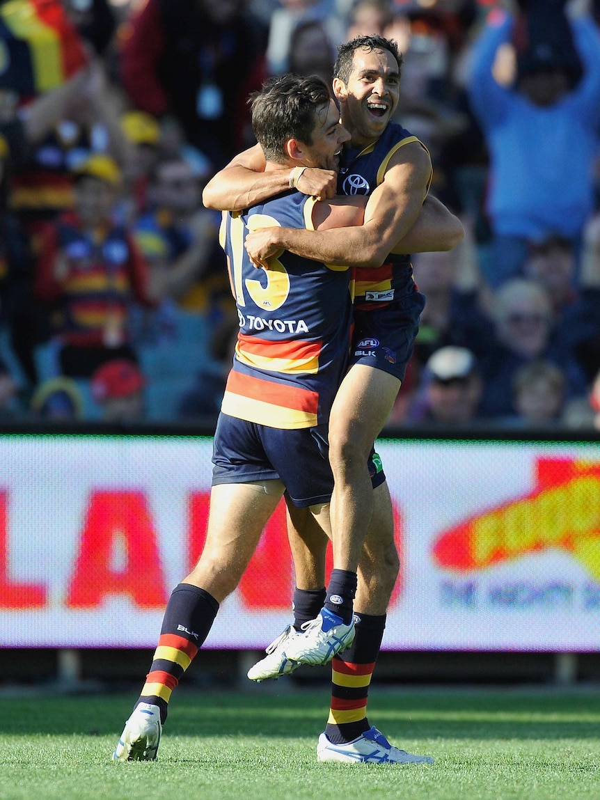 Eddie Betts celebrates a goal with Taylor Walker