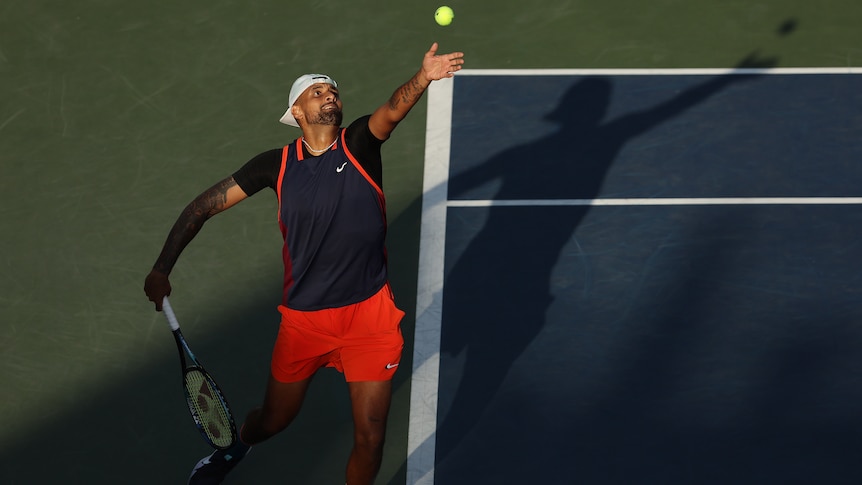 Nick Kyrgios serves during a US Open doubles match.