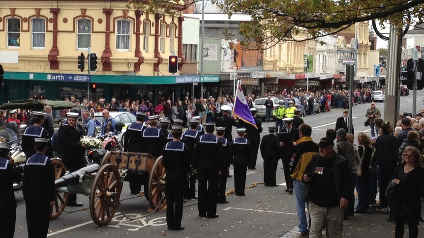 People line the streets of Launceston to watch the 2012 Anzac day parade
