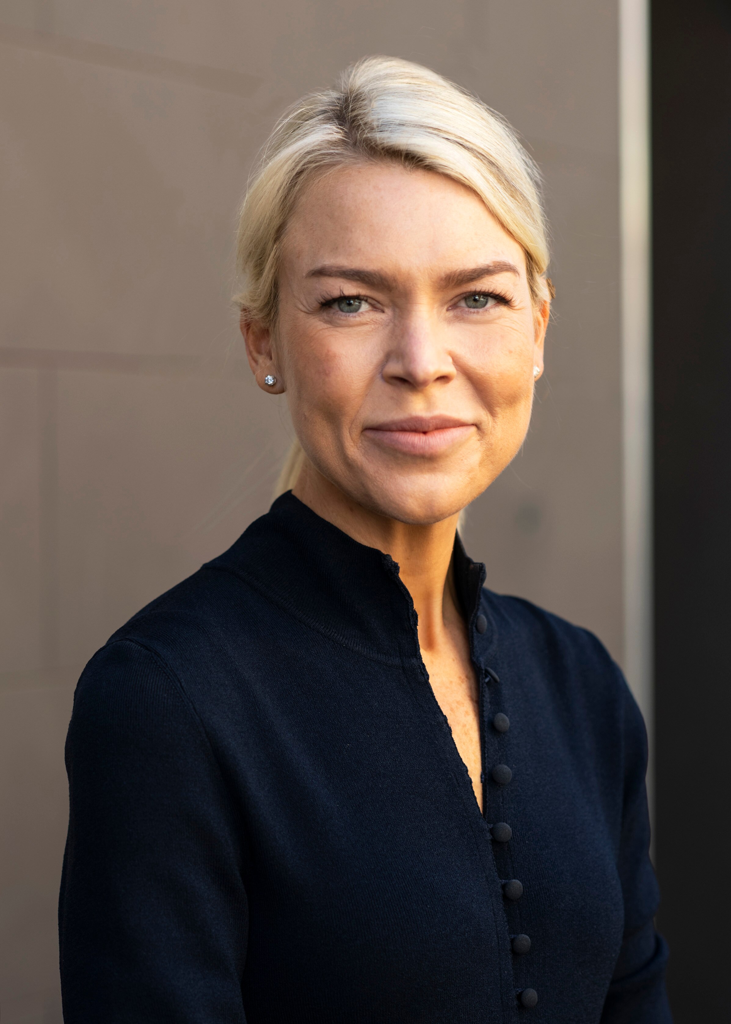 Psychiatrist Dr Lauren Taylor smiles as she looks at the camera