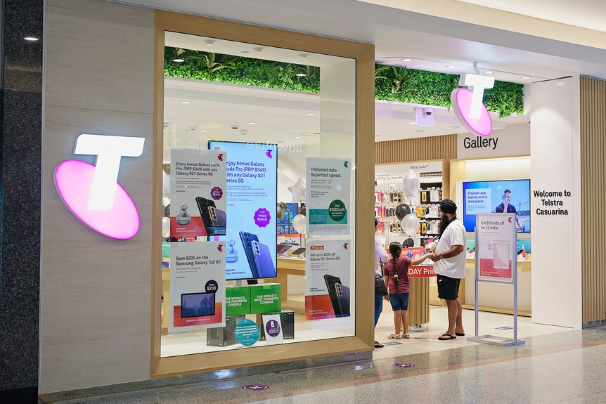 The shop front of a Telstra store in a shopping mall.
