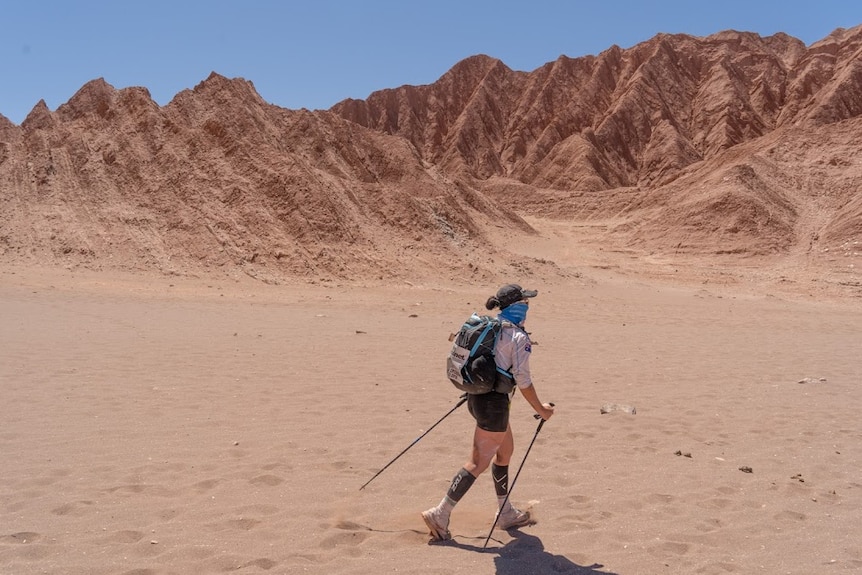 Athlete running through the desert in Chile, South America.
