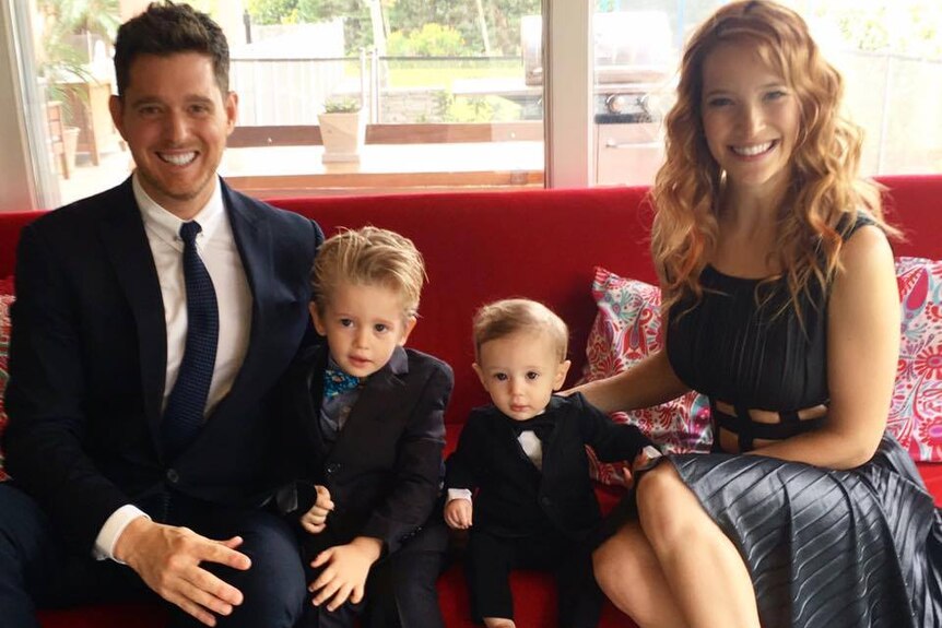Michael Buble and Luisana Lopilato sit with their children Noah and Elias.